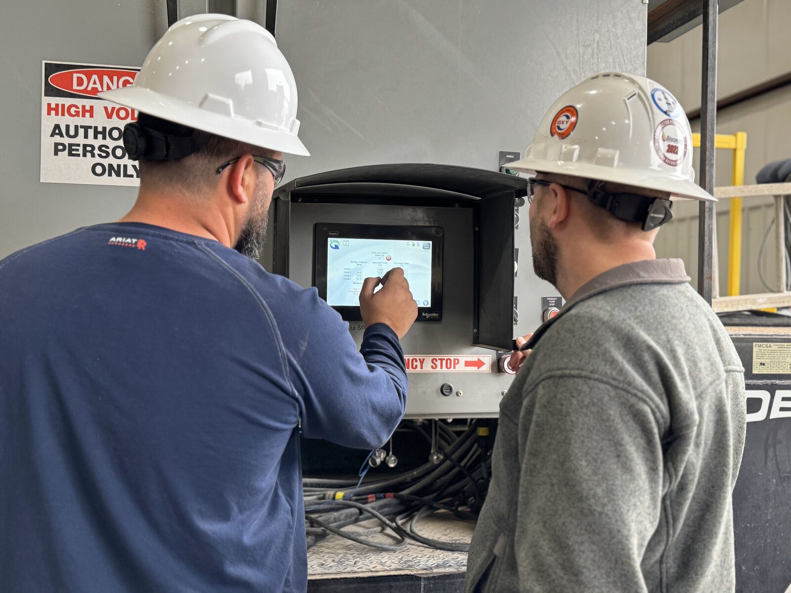 GTUIT technicians configuring equipment controls